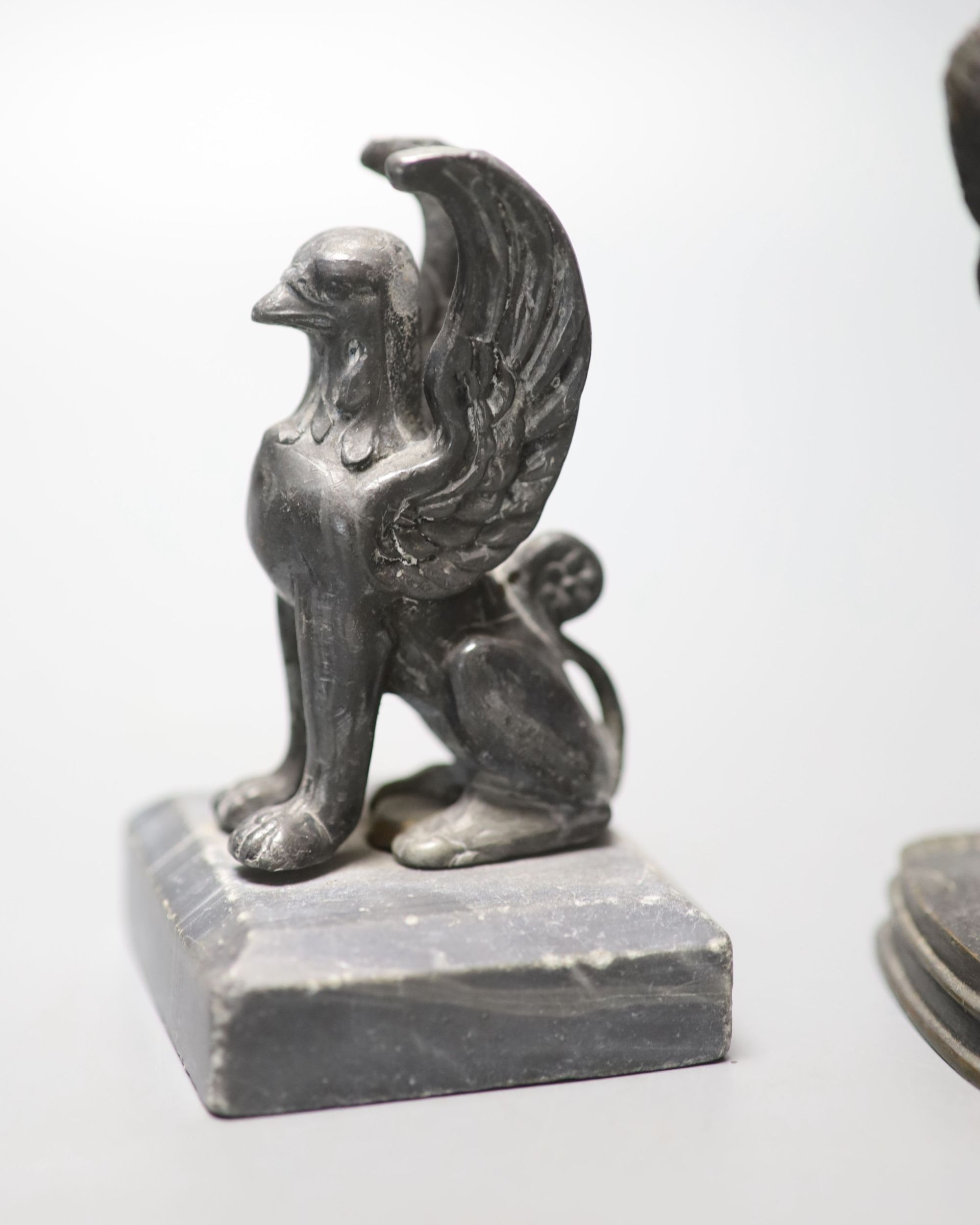 F. Pautrot. A seated bronze hunting dog, 12cm and a spelter figure of a griffin